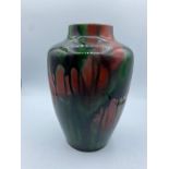 Red and green mottled studio drip glaze stoneware Vase. Stamped to base MH with a star. size 21cm H