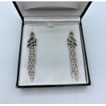 Pair of 18ct white Gold drop Earrings with with encrusted Diamonds, approx 65mm long and 15mm width,