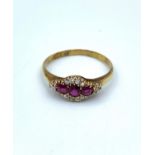 18ct yellow Gold antique Ring, having Rubies to centre and Diamond surround.