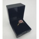 Stone set 18ct Gold Ring with Diamonds and Rubies. Mounted as an eight pointed star,with an inner