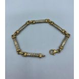 A 9ct yellow and white Gold linked woven Bracelet, weight 9g and 19cm approx