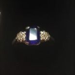 Vintage Sapphire Ring in Gold and Platinum band (tested as 18ct), small Diamond to each shoulder,