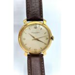 A vintage 18ct Yellow Gold IWC Schaffhausen Watch with leather strap, in working order, case 37mm
