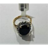 9K Yellow Gold Ring with dark blue Sapphire oval cut (12x9mm), weight 3.3g and size M (ECN602)