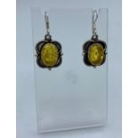 Pair of Pale Amber Earrings set in Silver mounts