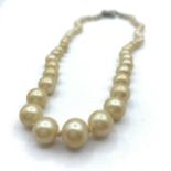 A Graduated Pearl Necklace with individual knotted string and silver ornate clasp. It weighs 18.4g