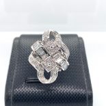 18K White Gold Ring with 47 Round and Baguette Diamonds (1.60cts D-F/VVS-VS), weight 12.3g and