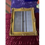 Gilt framed rectangular Mirror. 60cm W x 70cm H including scrolled corner frame.