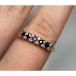 9CT Gold Stone Set Ring with Diamonds and Sapphire, almost half Eternity size Q/R