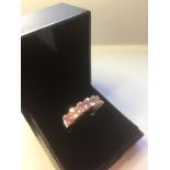 Silver Ring stone set with five pink Zirconias, marked 925 CZ and size O