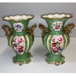 Pair of Rococo style handled Urns in green with floral design to front and rear panels, 24cm tall (