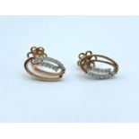 Pair of 9ct Rose Gold Earrings decorated with 0.60ct Diamonds, weight 2.4g