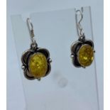 Pair of Pale Amber Earrings set in Silver mounts