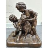 A late 19th century French Bronze Statue of two boys feeding a goat, 35x30x21cm and weight 10.2kg
