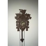 Vintage Swiss Cuckoo Clock chiming mechanical bellows pop out cuckoo and 2 pine cone shaped weights.