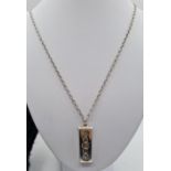 1977 Sheffield Silver Ingot on 58cm long Silver Chain, total weight 40.6g approx