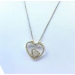 Diamond encrusted Double Heart designed Pendant on a 42cm long 9K Gold Chain, weight 2.9g