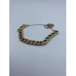 9ct Rose Gold chunky Curb Bracelet with heart padlock, and safety chain weight 15.58g approx