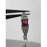 18ct White gold Ring with 4x4mm Ruby centre and 12 Princess Cut Diamonds (approx 0.24ct), weight 2.