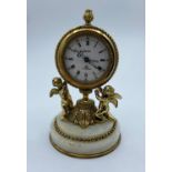 Vintage 8 Day Swiza Clock with alarm on a marble base supported by 2 Cherubs, 14cm tall and weight