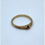 Yellow Metal Vintage Ring with red stone centre, size H1/2