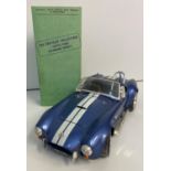 Scale Model (1-18) of a 1967 A.C.Cobra with registration Book from the 'Crestley Collection', 22cm