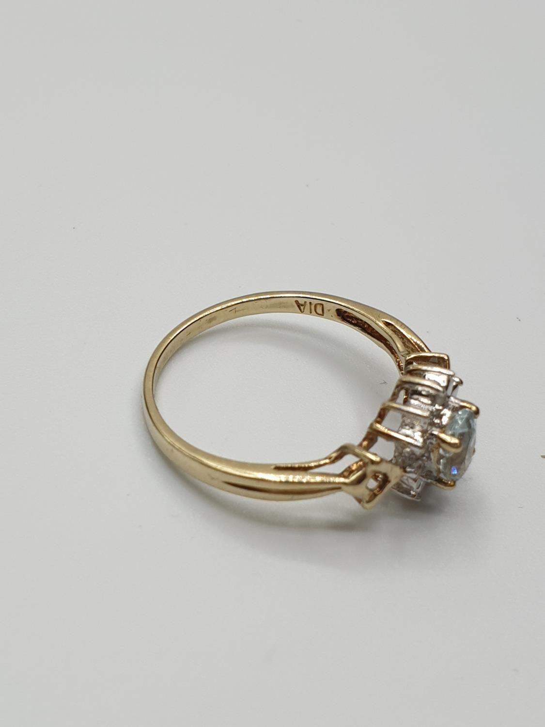 Stone set 9ct Yellow gold Ring having an oval Topaz to centre of mount with a surround of small - Image 5 of 8