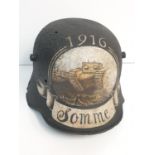 WW1 Imperial German M16 Stahlhelm that was found on the Somme. Post War Memorial commemorating the