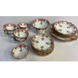A Chapman England Floral Bone China Tea set, comprising of 6 cups and saucers, 6 side plates and 2