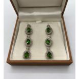 Pair of Stone set Silver Drop earrings, each earring having three green Russian diopside stones in