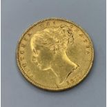 1877 Gold Sovereign with young Victoria head and shield on reverse side in very good condition