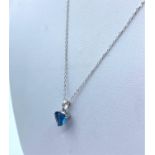 9K White Gold Chain with a Blue Stone Pendant, weight 1.4g and 44cm long chain