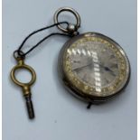 Silver open faced Ladies Pocket Watch circa 1890, having floral design chase work to case and