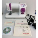 Toyota Home Sewing Machine, ergonomic design with instruction booklet, 38x28cm approx
