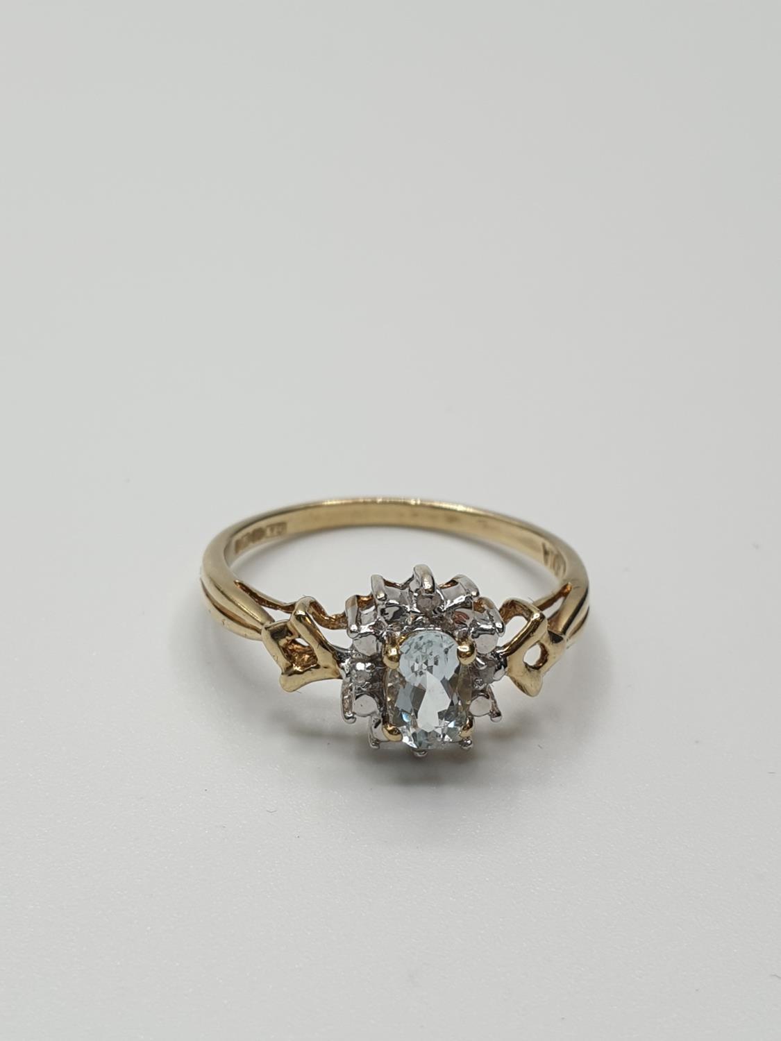 Stone set 9ct Yellow gold Ring having an oval Topaz to centre of mount with a surround of small - Image 4 of 8