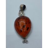 Silver and Amber set Pendant, having a chunky piece of pear shaped Baltic Amber in a silver mount