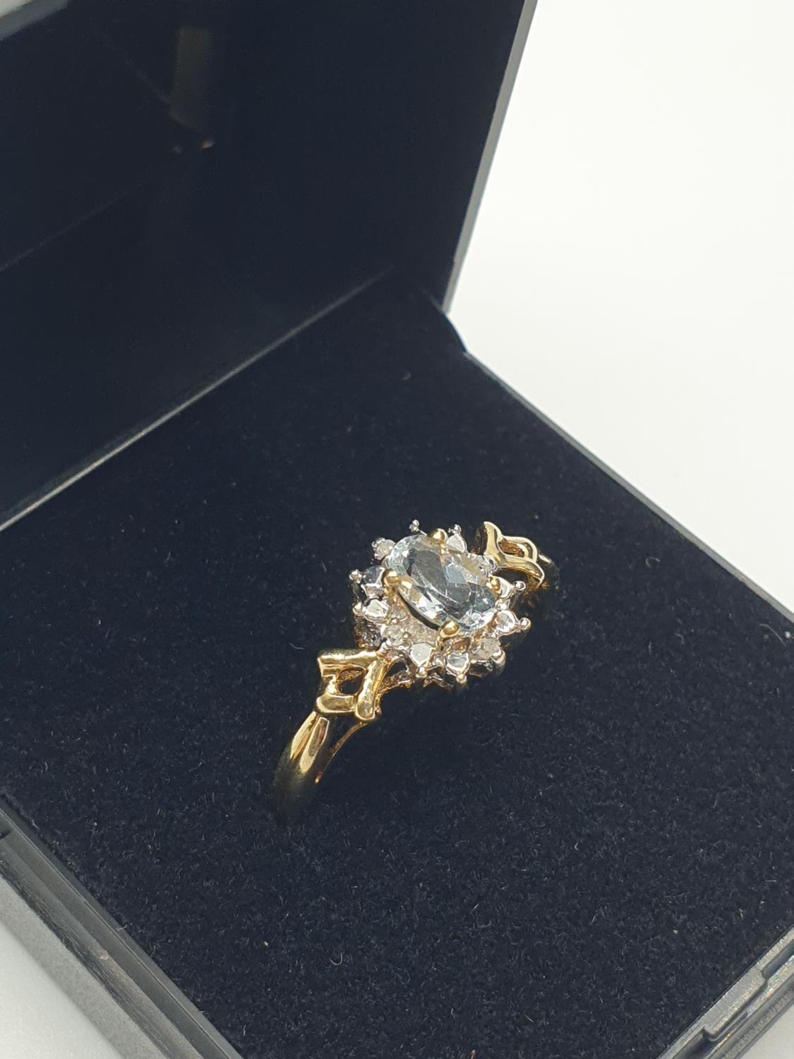 Stone set 9ct Yellow gold Ring having an oval Topaz to centre of mount with a surround of small - Image 2 of 8