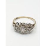 Stone set 9ct Yellow Gold Cluster Ring, having a large centre clear stone with a 14 Zirconia