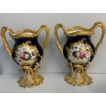 A pair of H&R Daniel Baroque Vases glazed blue with gilded handles and laurels, slight hairline