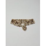 A quality 9ct Gold Gate Bracelet, having a full nine gates each having six gold strands, closed with