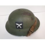 WW2 British ?Tommy? Helmet with the insignia of a Ghurkha unit, made by Harrison Bros & Howson circa