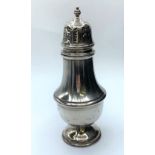 Silver sugar shaker made in Birmingham in 1967, weighs 131g and is 18cms tall