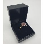 Stone set 18ct Gold Ring with Diamonds ,with an inner ring of rubies, additional diamond to