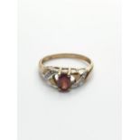 9CT Gold Ring with Diamond Encrusted shoulders and Garnet Centre Stone, weight 1.8g and size N/O