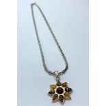 Scandinavian Silver and Amber Pendant and Chain, the pendant having nine stones in various shades of