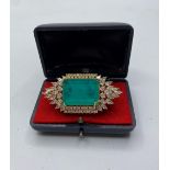 A dress ring with lab created emerald (25x18mm) and sapphires marked 18KGL, designed and signed