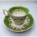 First gadroon shape cup and saucer with small piece missing from handle.