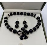 A Mexican Obsidian Choker Necklace and matching Earrings set in a presentation box.