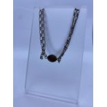A Dainty Silver Bracelet. Having Twin Chain Link Strands and a Tigers Eye Centre Piece. Marked at