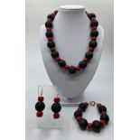An unusual Hawaiian lava and red coral necklace, bracelet and earrings set (beads 20mm).
